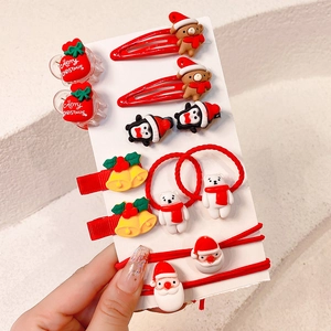Detail van 10-delige kersthaaraccessoires set met kerstman en rendier motieven