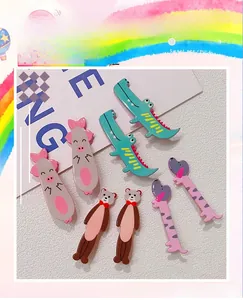 Detail view of cute 3D cartoon animal hair clips featuring crocodile pig and bear designs