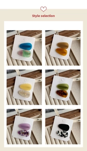 Close-up of acetate waterdrop hair clips in six different marble and matte resin finishes