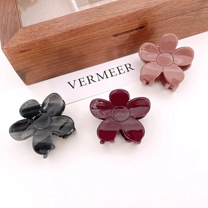Floral acetate hair clips in grey, burgundy, and pink with handmade engraving