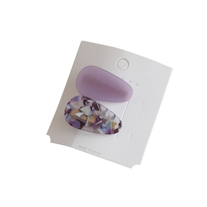 Elegant waterdrop acetic acid hair clips in purple matte and marble patterns on display card