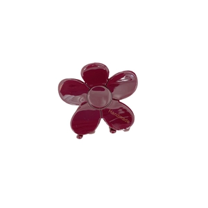 Elegant wine red floral acetate hair claw with a glossy finish and handmade golden text