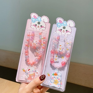 Detailed view of colorful beaded jewelry sets with cute animal charms for kids