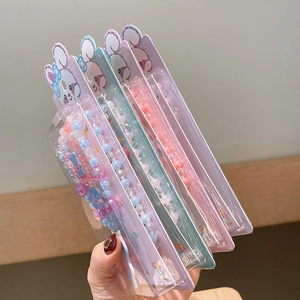 Detailed view of colorful beaded bracelets for kids with cute bunny packaging