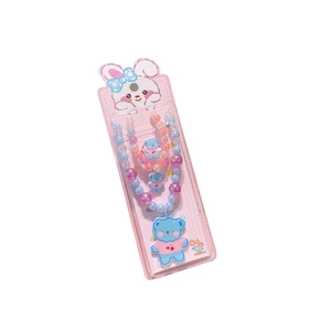 Handmade beaded jewelry set for kids featuring a blue bear pendant and colorful pearls