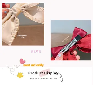Detail of satin bow hair clips showing lace edges and 6cm metal alligator clip structure