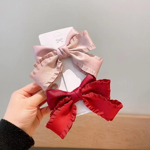Set of two vintage satin bow hair clips in pink and wine red with pleated ruffles