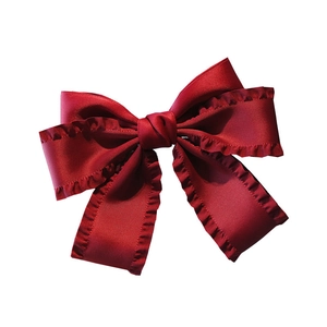 Elegant wine red satin bow hair clip with ruffled edges and classic French style