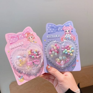 DIY colorful bead jewelry kit for kids including flower beads and heart-shaped gift box