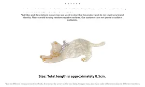 Detailed view of white pearlescent cat hair clip with golden outlines and 8.5cm length