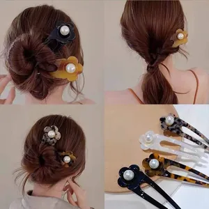 Detail of floral acetate hair pin with pearl accent shown in various elegant hairstyles