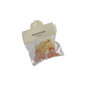 Niedliches Set aus vier Mini-Haarklammern mit Schleifen in Pastellrosa und Gelb