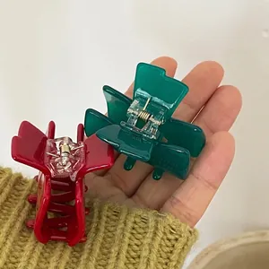 Jelly colored bow hair clips in red and dark green acetate for stylish side hair styling