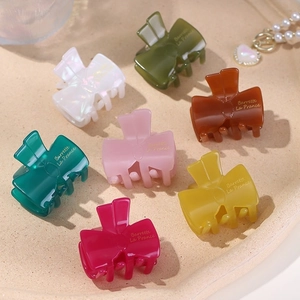 Bow-shaped jelly color acetate hair claws set in seven various translucent pastel shades