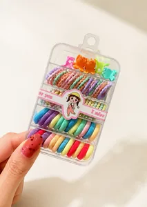 Detailed view of colorful elastic hair ties and mini hair claws in a transparent box