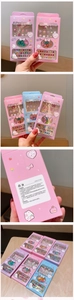 Detailed view of colorful cartoon children nail art kit including stickers and shiny gems
