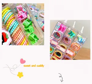 Detail showing candy colored high elastic hair bands and mini clips in a clear storage box