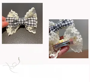 Detail of lace and plaid bow hair clip with a fabric-wrapped metal duckbill clip for girls