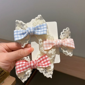 Three-piece set of girls' bow hair clips with lace trim in blue, pink, and red plaid patterns