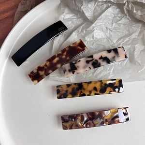 Chic acetate hair clips set in tortoiseshell patterns and marble textures for women