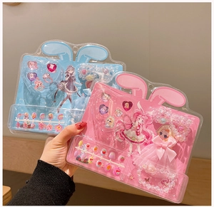 Close-up of colorful cartoon nail stickers and jewelry gift sets for kids in packaging