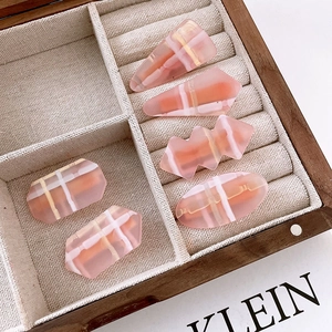 5-piece set of pink geometric resin hair clips including triangle and wave shapes
