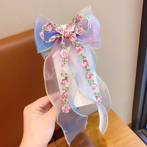 Embroidered organza bow hair clip with gradient blue-purple mesh and golden trim