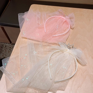 Pink and white princess veils with sequined headbands and a pearl crown for girls