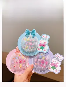 Detailed view of three colorful cartoon press-on nail sets for girls with 3D embossed patterns