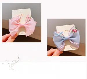 Detailed embroidery on double-layered organza bow hair clip for girls in pink and blue