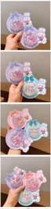 Detail showing colorful cartoon rabbit themed fake nail sets for little girls