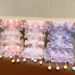 Détail de barrettes pour filles avec nœuds en tulle, lapins et glands de perles
