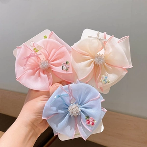 Three-piece set of embroidered tulle bow hair clips with rhinestones in pink blue and cream