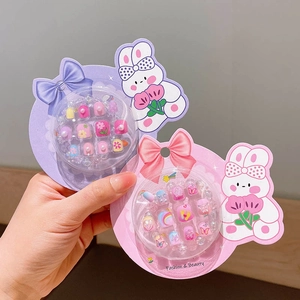 Cute cartoon press-on nails set for girls with rainbow and flower patterns in gift packaging