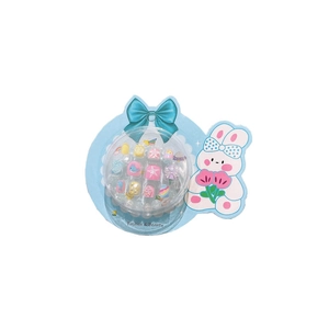 Kids press-on nail kit with cute cartoon designs like rainbow and whale for little girls