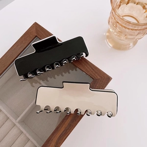 Set of minimalist large hair claws in black and cream beige with contrast border