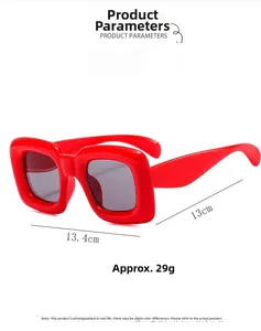 Detail view of red square frame kids sunglasses with dark grey lenses and size specs