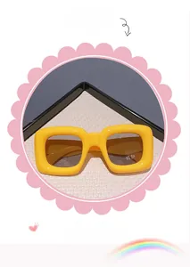 Detailed view of children's bright yellow square sunglasses with dark brown lenses