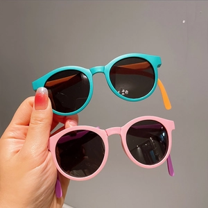 Foldable round kids sunglasses in blue orange and pink purple colors with UV protection