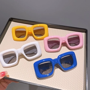 Kids chunky square sunglasses in yellow, pink, white, and blue colors for boys and girls