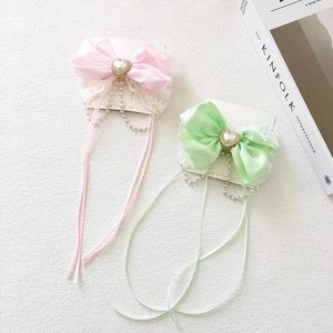 Elegant bow hair clips with tassels, lace, and heart pearls in pink and green colors