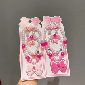 Parure bijoux perles pour enfants avec grands nœuds comprenant collier et bracelet