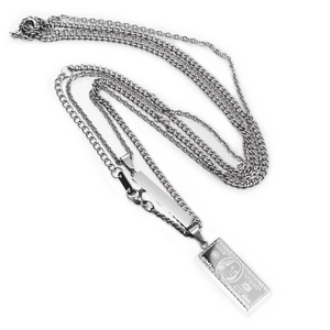 Detailed shot of hip hop silver necklace with dollar bill pendant and polished bar