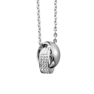 Detail shot of intertwined double rings with crystal pavé on a silver-toned chain