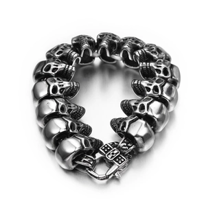 Macro detail of punk skull bracelet showing aged texture and gothic metal carvings