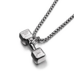 Macro detail of 316L stainless steel dumbbell pendant showing high-quality polished finish