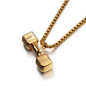 Macro shot of 18K gold plated 316L stainless steel dumbbell pendant showing smooth polish