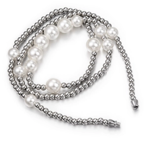 Detail of trendy pearl necklace with silver metal beads and industrial screw clasp closure