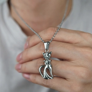 Hip hop style stainless steel necklace featuring a hollow cat pendant with sparkling zircon