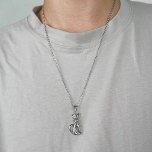 Silver cat silhouette pendant necklace with sparkling stone detail on a neck model